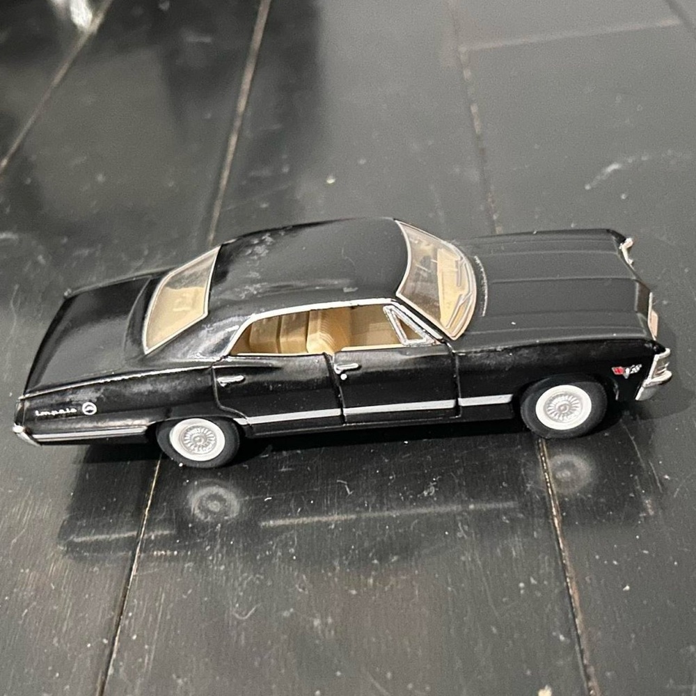 Black 1967 Chevrolet Impala diecast model car